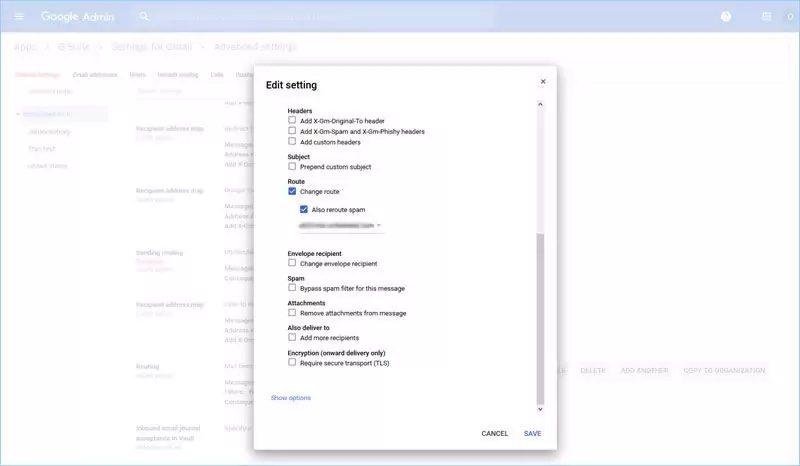 A screenshot of the Google Admin Edit Setting popup window for routing. Boxes for "Change route" and "Also reroute spam" are ticked.