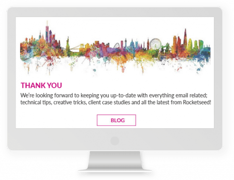 A computer screen showing a "THANK YOU" message above a "BLOG" button, with a colourful line drawing of a city above.