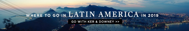 A banner with the words "Where to go in Latin America in 2019" and "Go with Ker & Downey" superimposed on an image of a harbourside city.