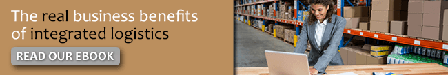 An email banner with the message "The real business benefits of integrated logistics READ OUR EBOOK" next to a photo of a woman typing on a laptop in a fulfillment centre.