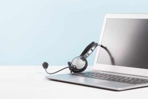 headphones and computer on a desk
