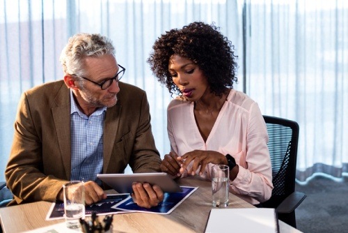 male and female working on a tablet