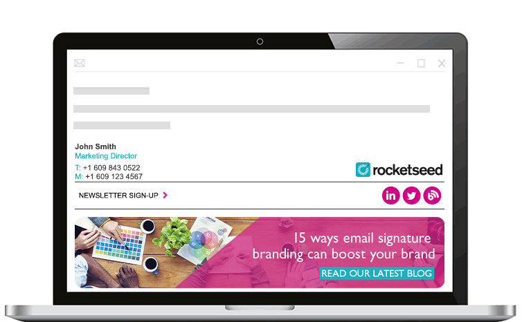 A laptop with a Rocketseed email signature on screen.