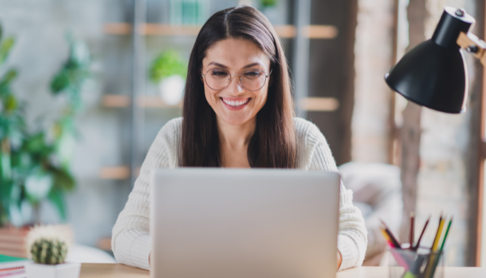 A lady working at her desk on her laptop