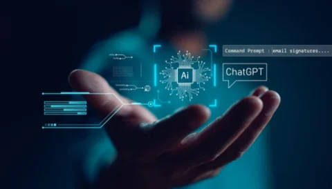 A hand that has the words "AI" & "ChatGPT" floating in modern bubbles