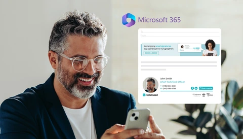 A smiling man looking at his mobile phone with an example of professional branded email and the Microsoft 365 logo